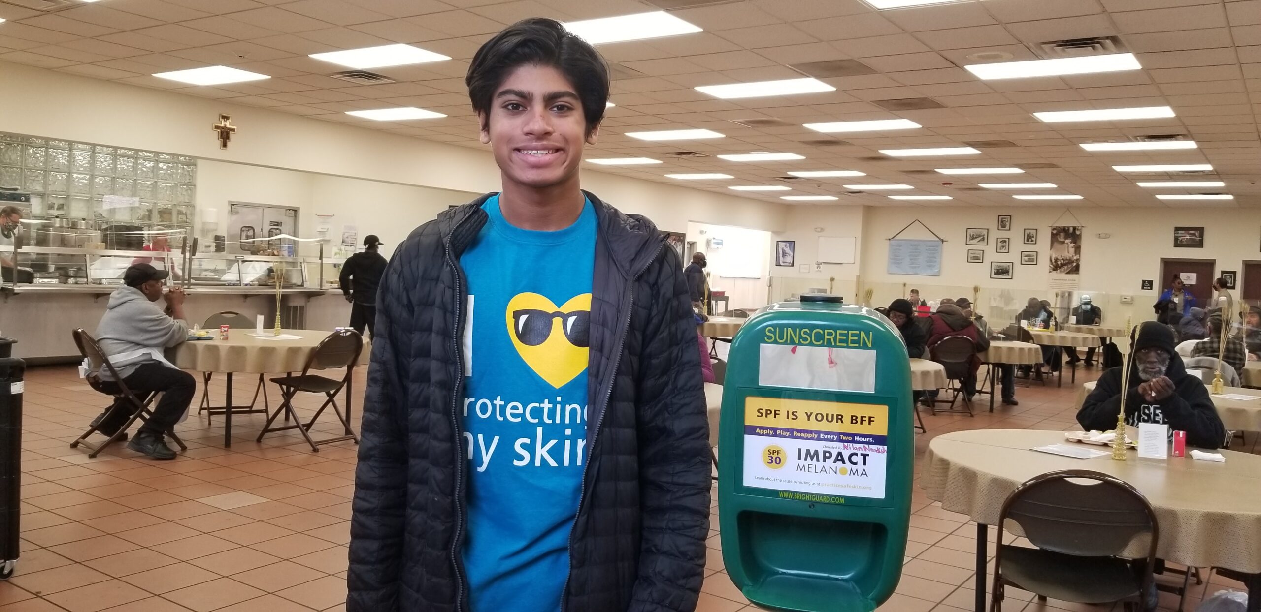 Nilan Nandish places sunscreen dispensers in Detroit